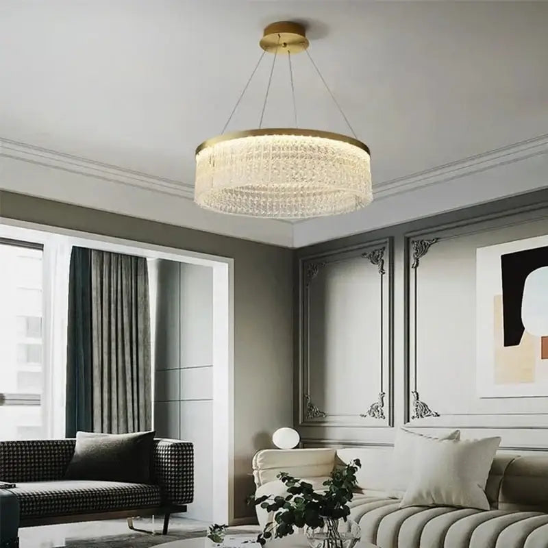 A modern circular crystal glass gold pendant chandelier with cascading clear beads for dining room decorbites crystal glass