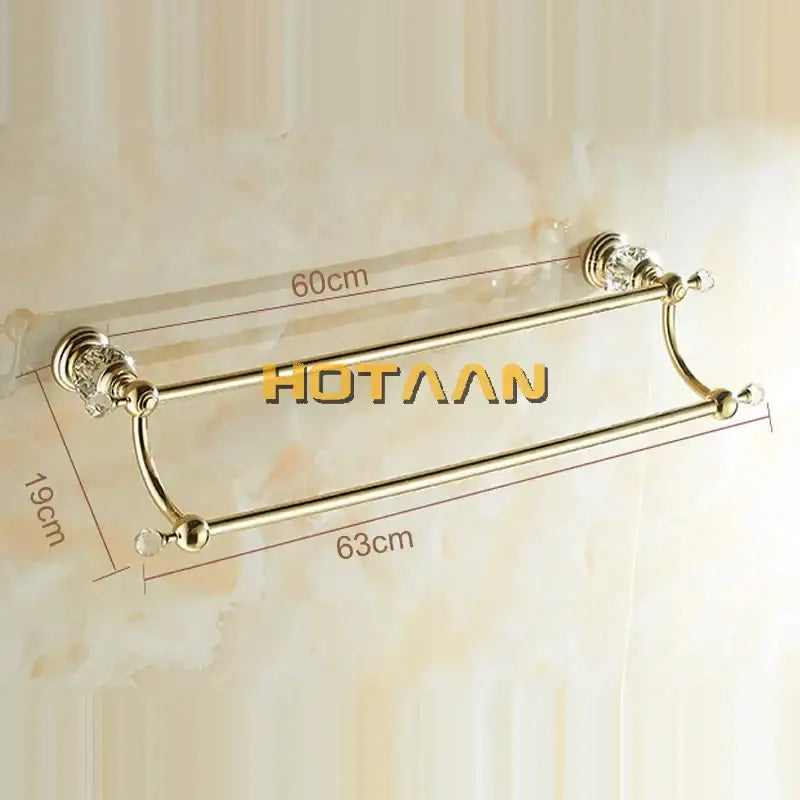 Gold-colored double towel bar with crystal embellishments on bars and ends for elegant bathroom use