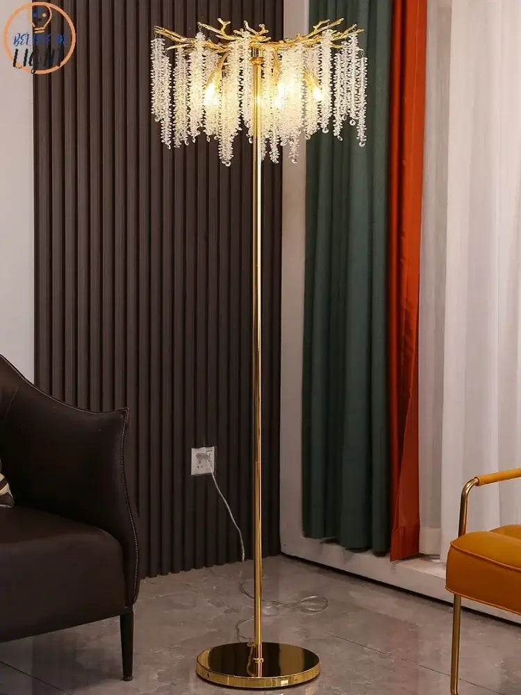 Gold-toned floor lamp with branching design and cascading crystal strands decorbites crystal gold led for living room decor