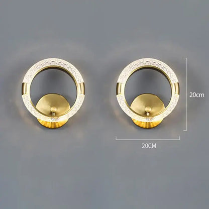 Gold-toned crystal nordic wall sconce with textured crystal outer ring and smooth inner circle for bedroom decorbites decor