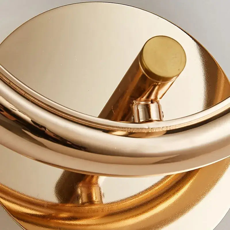 Gold-toned decorbites crystal nordic wall sconce with sleek curved polished metallic finish for bedroom lighting