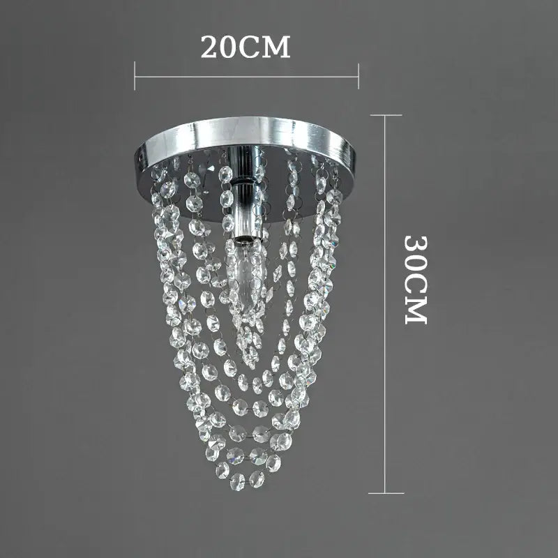 A sleek chrome ceiling light with cascading clear crystal beads from decorbites crystal sun flower chandelier