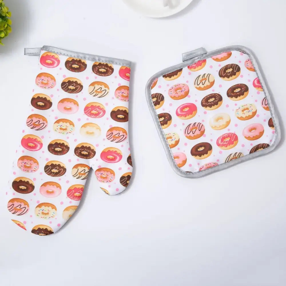 A decorbites cotton kitchen baking glove and pot holder set featuring donut-themed pink brown and white icing designs