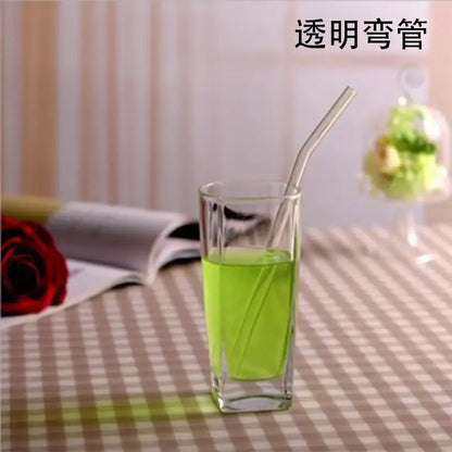Transparent curved glass drinking straw designed as a kitchen accessory for glass drinking and beverage use