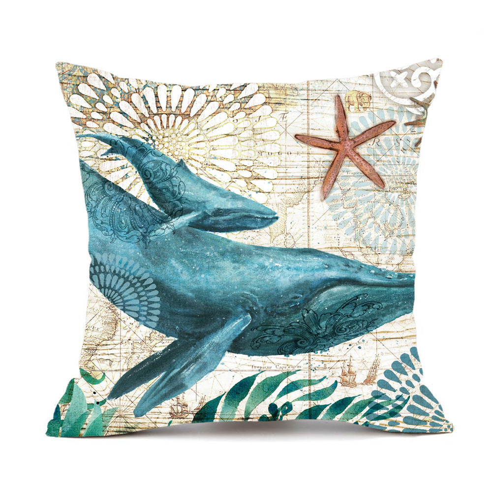 Blue whale throw pillow with starfish and seashells design, cotton material.