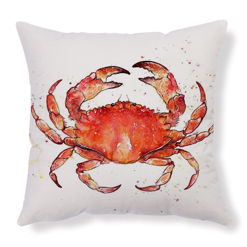 Red crab throw pillow with watercolor design on white background.