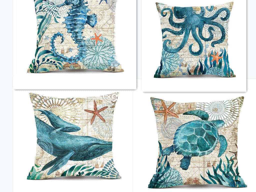 Blue sea-themed throw pillow set with octopus, turtle, whale and seahorse designs on a linen-like material.