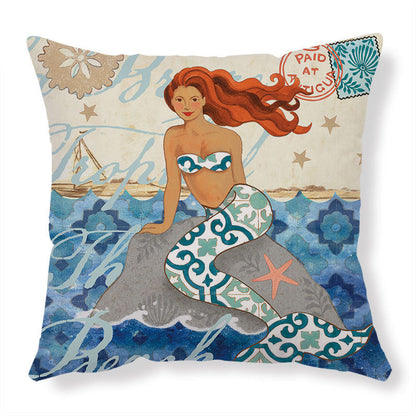 Mermaid-themed throw pillow with teal and white patterned tail, red hair, and striped top.