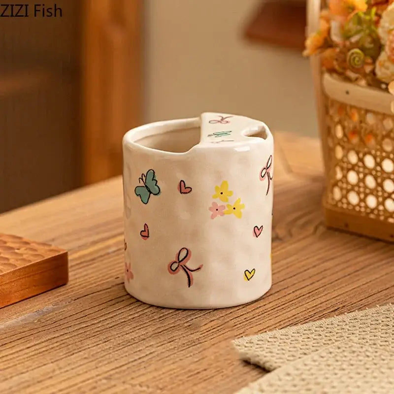 White ceramic toothbrush holder with pastel butterfly heart flower pattern complements decorbites bowknot pattern coffee mug