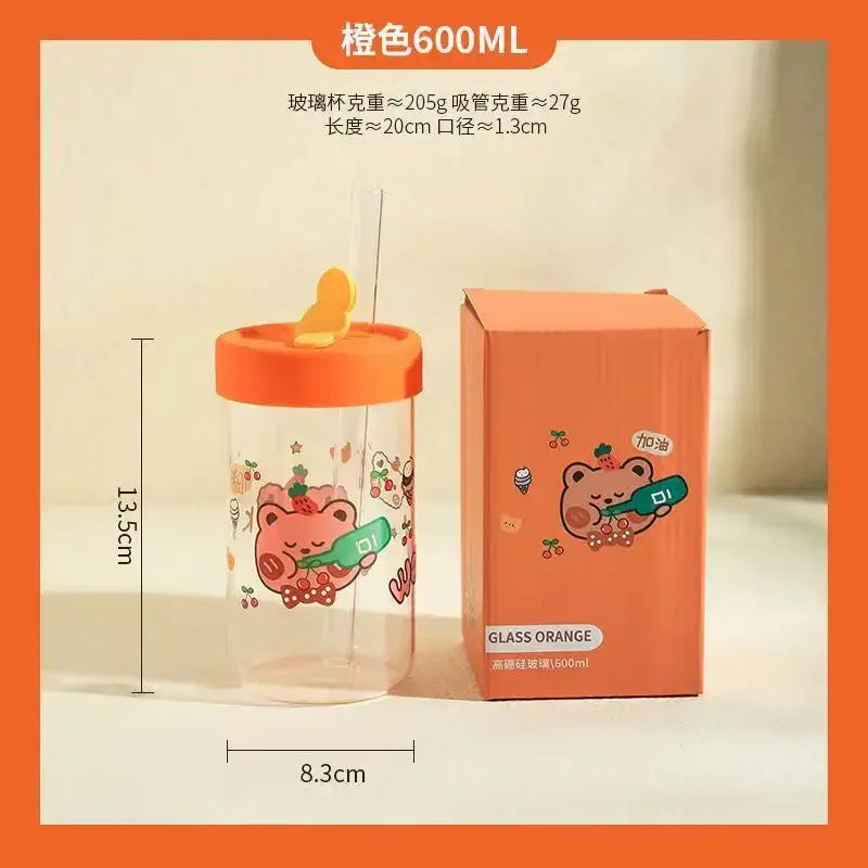 Orange-themed glass cup with a cartoon bear design and orange lid featuring yellow straw from decorbites cartoon glass collection