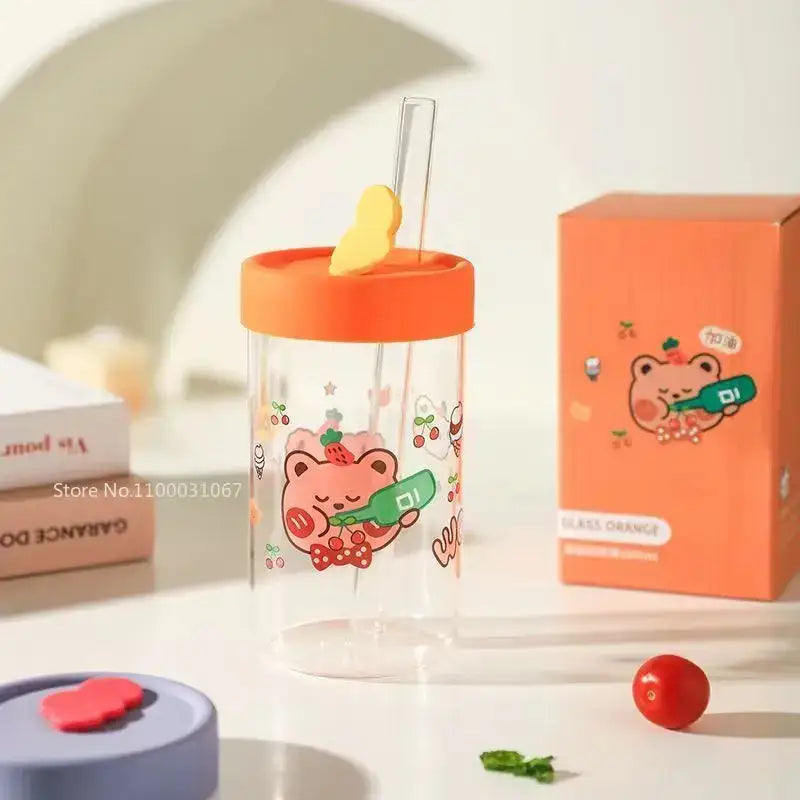 Cute bear cartoon glass cup with orange silicone lid and yellow butterfly straw featuring decorbites cartoon glass design