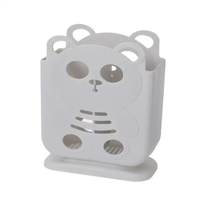 White plastic bear-shaped decorbites cutlery organizer stand with cut-out details for kitchen storage