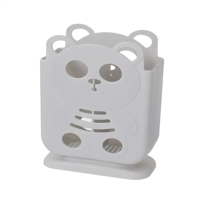 White plastic bear-shaped decorbites cutlery organizer stand with cut-out details for kitchen storage