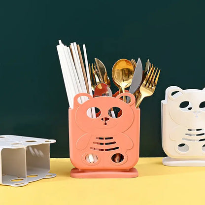Pink plastic bear-shaped decorbites cutlery organizer stand with cutout details for kitchen storage and decorbites kitchen storage