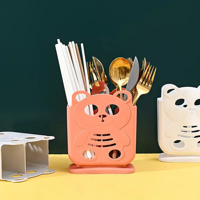 Pink plastic bear-shaped decorbites cutlery organizer stand with cutout details for kitchen storage and decorbites kitchen storage