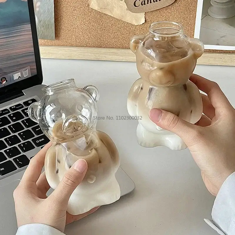 Clear glass bear glass cups with frosted white ceramic base designed for iced beverages in kitchen drinkware
