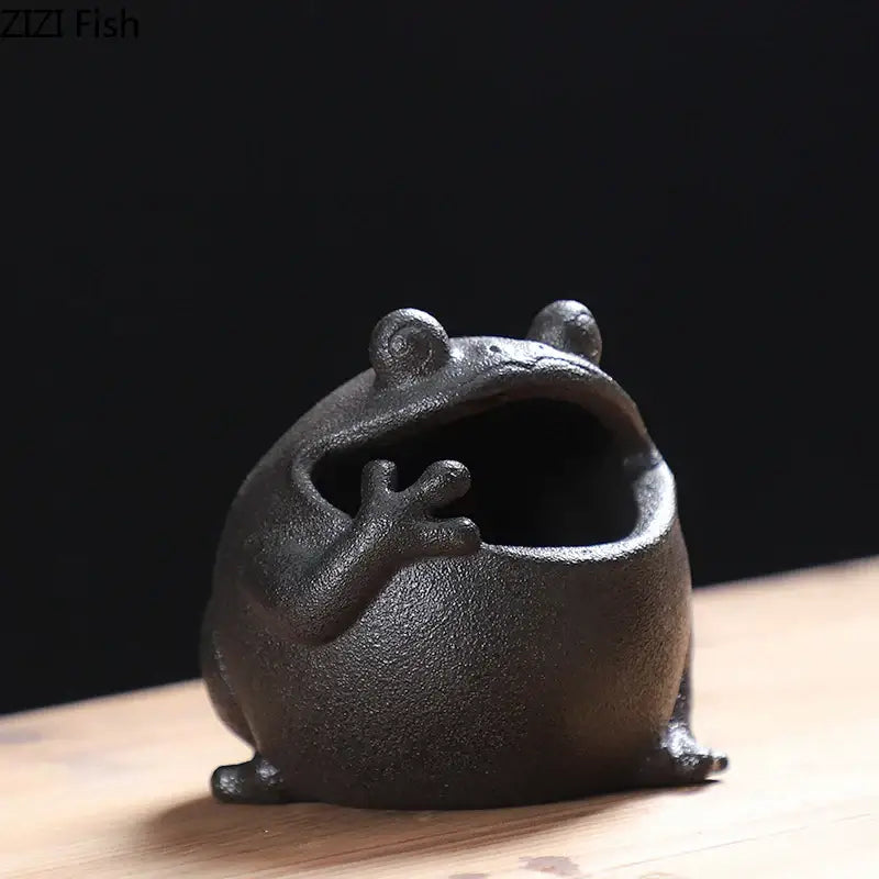 Black ceramic ashtray shaped like a cute big belly frog with textured surface and open mouth for living room decor gift