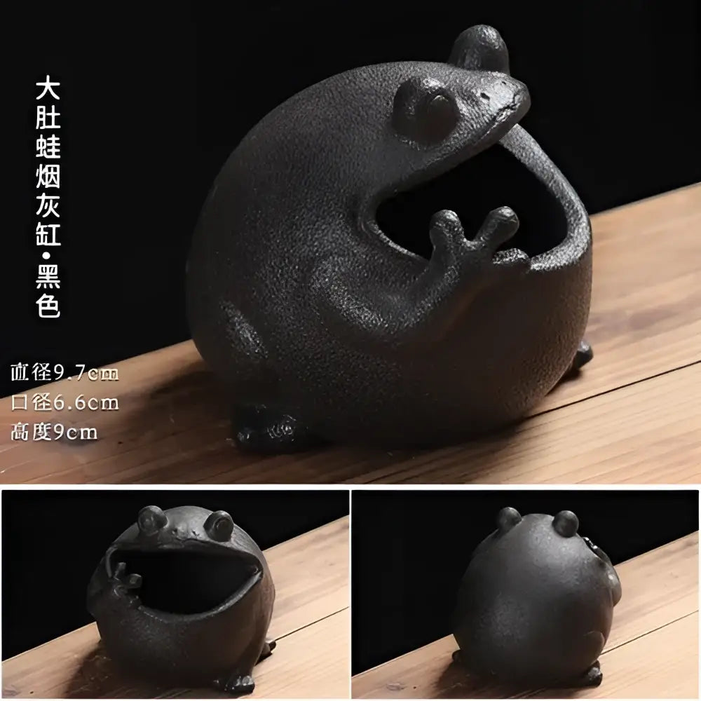 Black ceramic ashtray shaped like a cute big belly frog with a textured surface and wide open mouth for living room decor