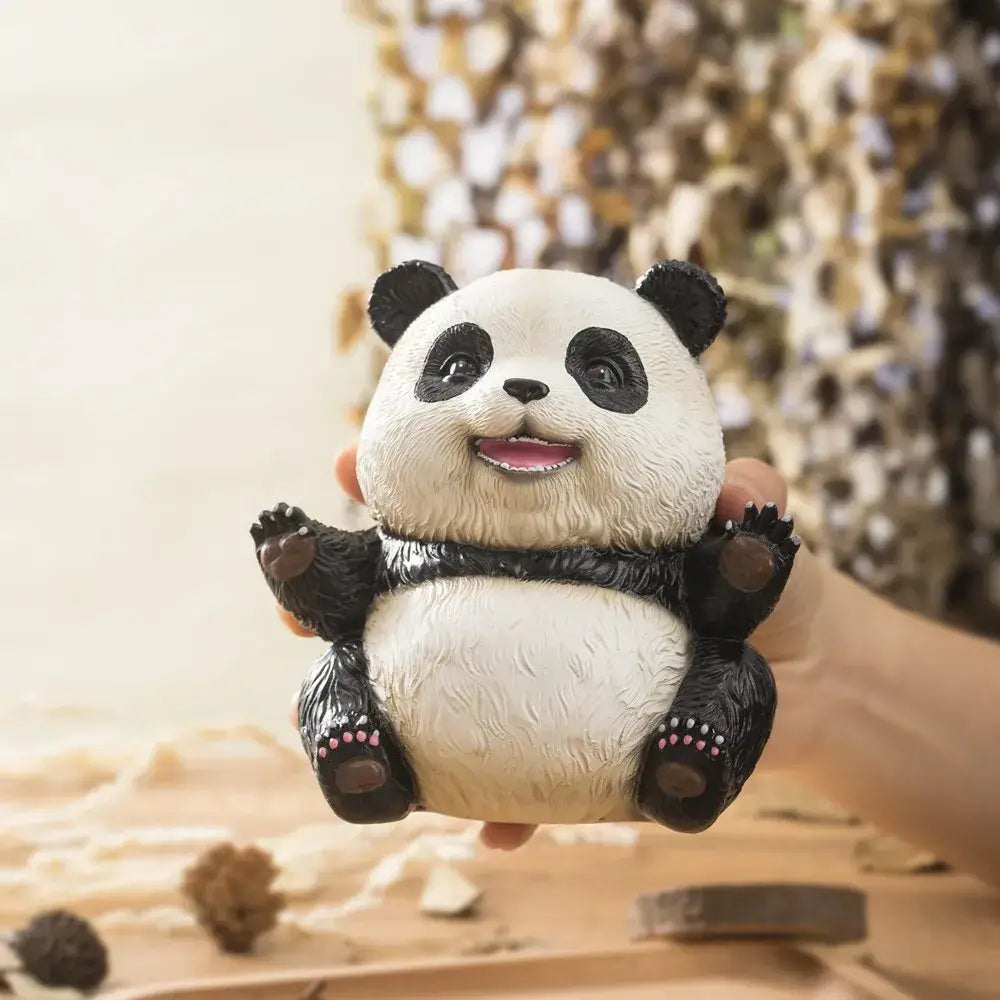 Adorable black and white panda baby figurine with textured fur and pink paw pads for living room decor