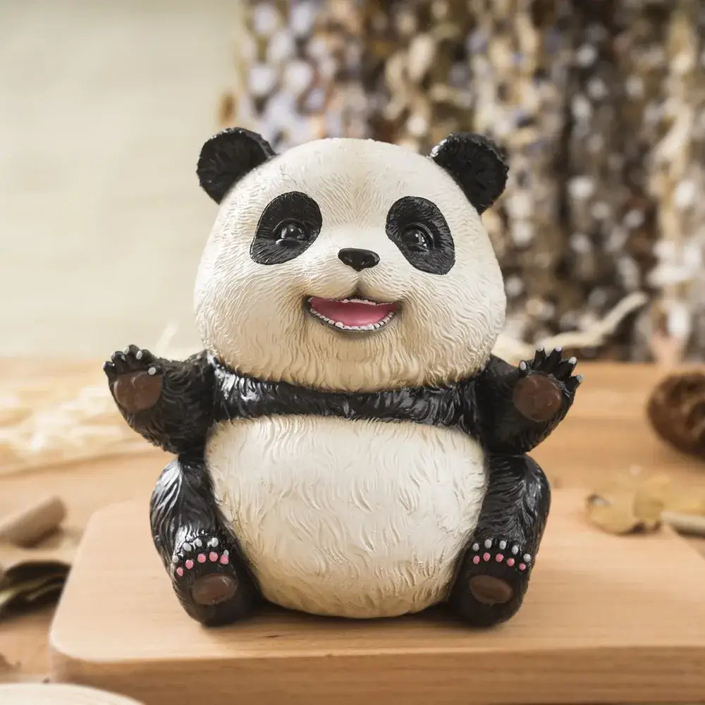 Adorable black and white panda baby figurine with textured fur and pink paw pads for living room decor