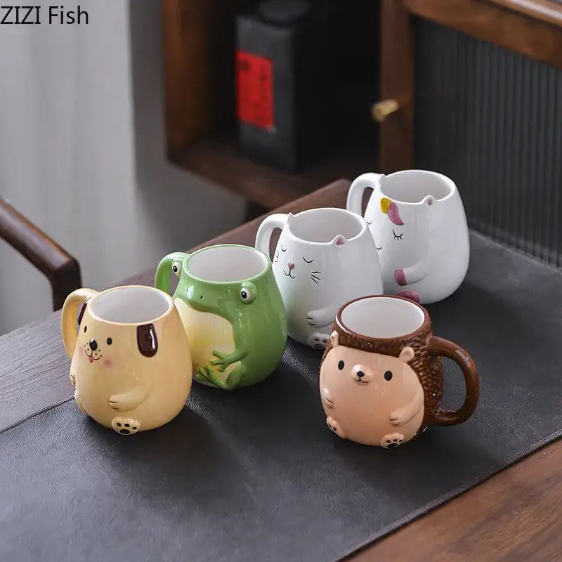 Set of five cute cartoon animal ceramic mugs featuring dog, frog, cat, unicorn, and hedgehog for breakfast use