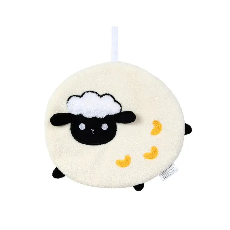 Cream-colored plush sheep-shaped coral fleece hand towel with black embroidered face and yellow heart appliqués for kitchen