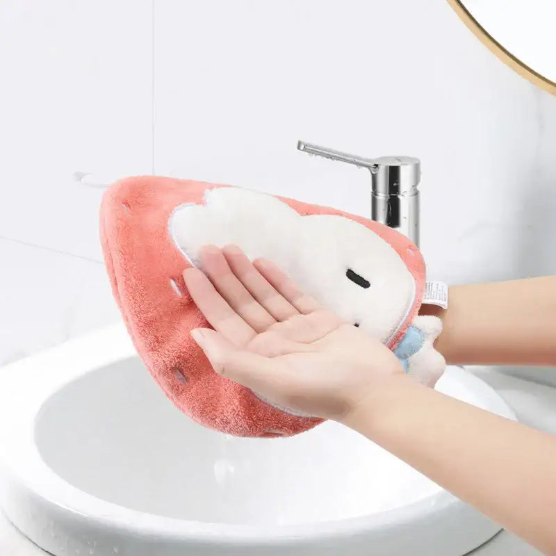 Pink and white coral fleece hand towel with cartoon animal design and plush texture for kitchen and bathroom use