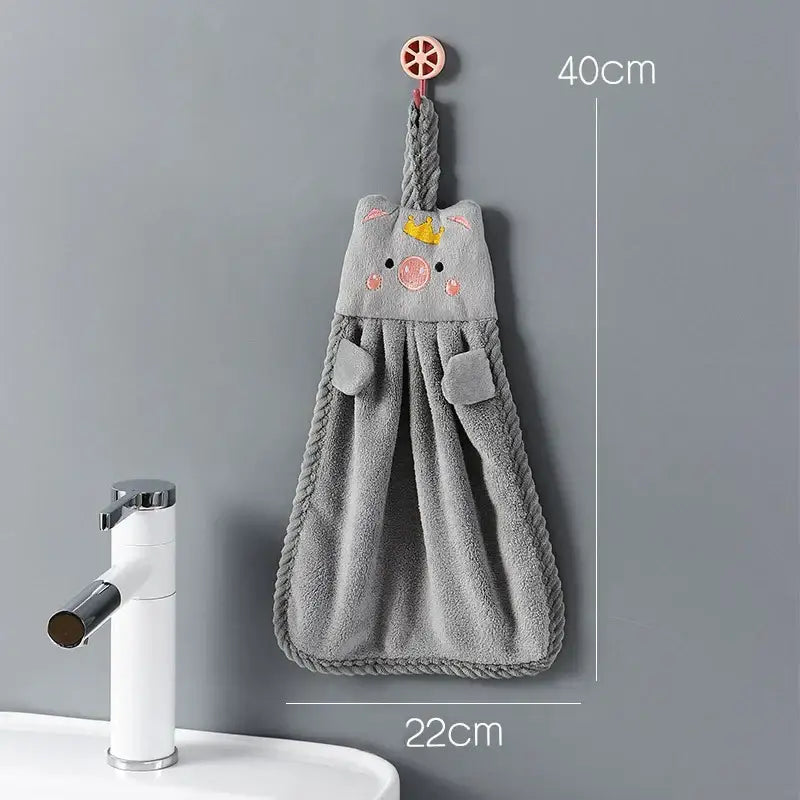 Gray plush cartoon animal hand towel with embroidered yellow crown pink cheeks rope edges and fabric pockets for decorbites decor