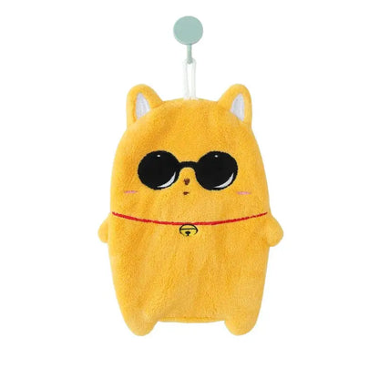 A cute cartoon animal hand towel in thick yellow plush shaped like a cat with embroidered sunglasses and a bell collar