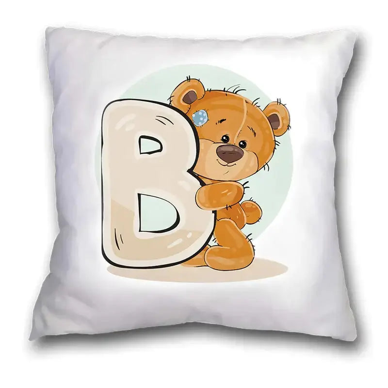 White pillow case with cute cartoon bear hugging a beige letter b on light blue background for bedroom decor
