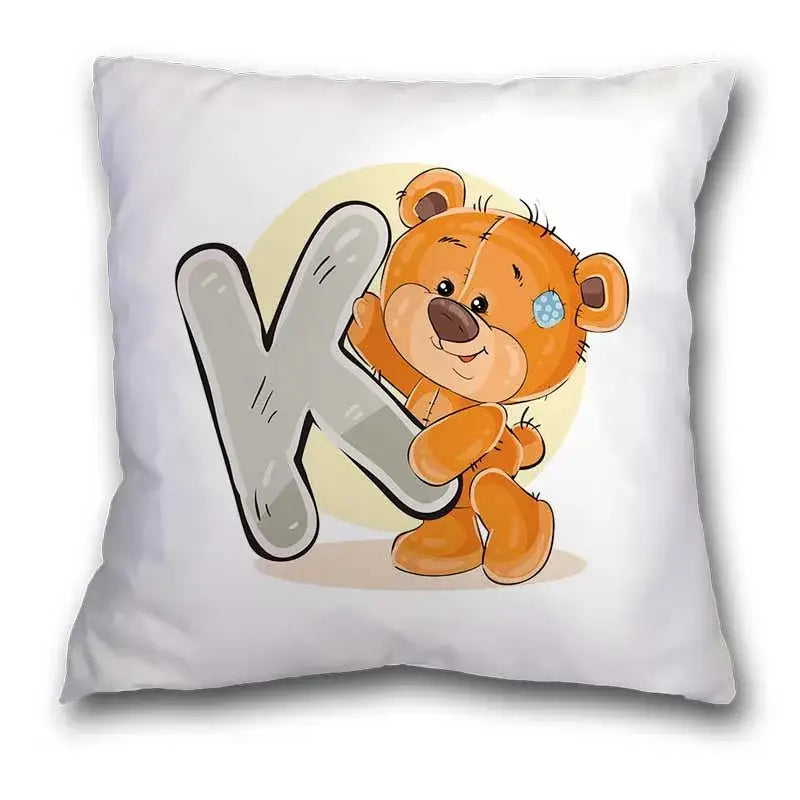 White pillow case with a cute cartoon bear animal holding a large gray letter k for bedroom decor