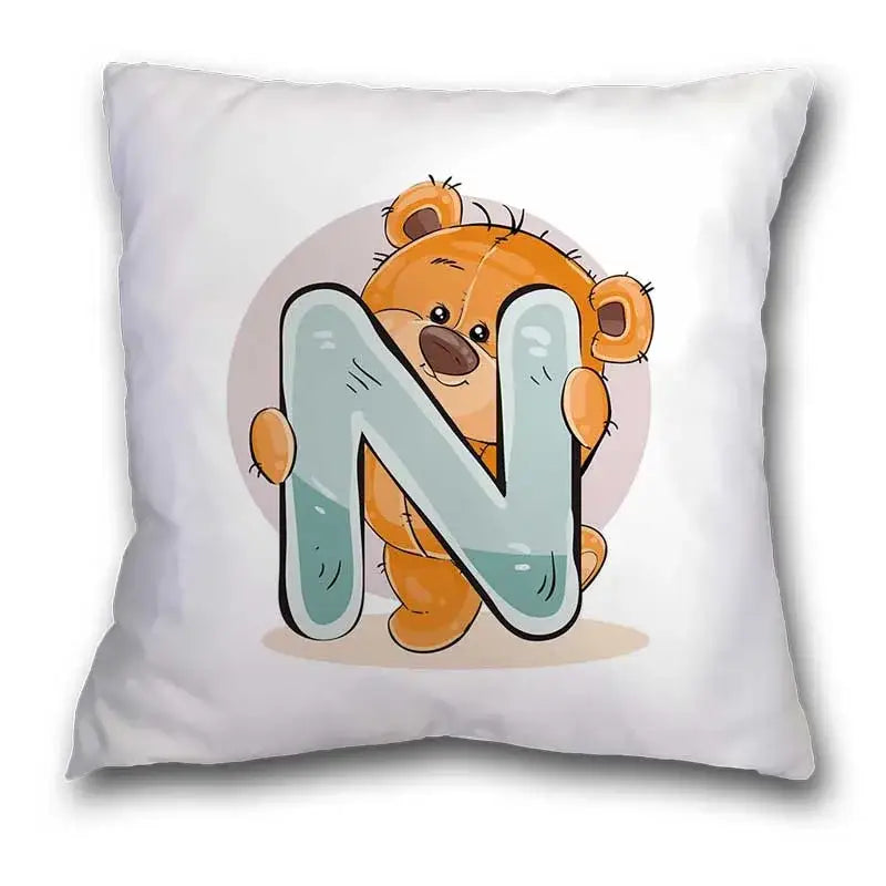 White pillow case with a cute cartoon bear animal holding a light blue letter n for bedroom decor