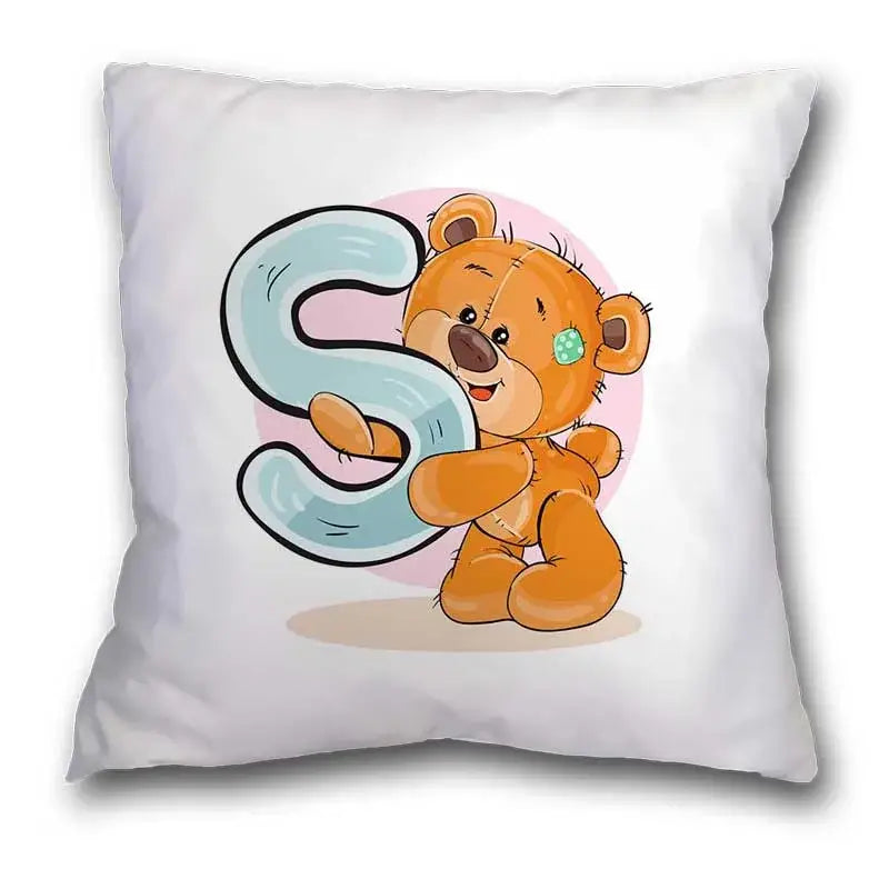 White pillow case with a cute cartoon bear animal hugging a light blue letter s for bedroom decor