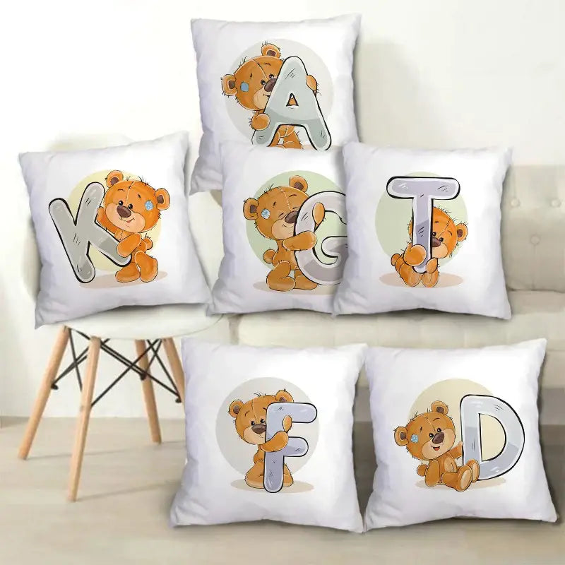 White pillow cases featuring cute cartoon bear animal holding oversized silver letters for bedroom decor