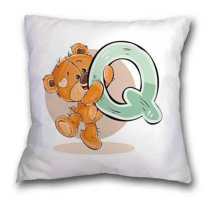 White pillow case featuring a cute cartoon bear animal holding a mint green letter q for bedroom decor