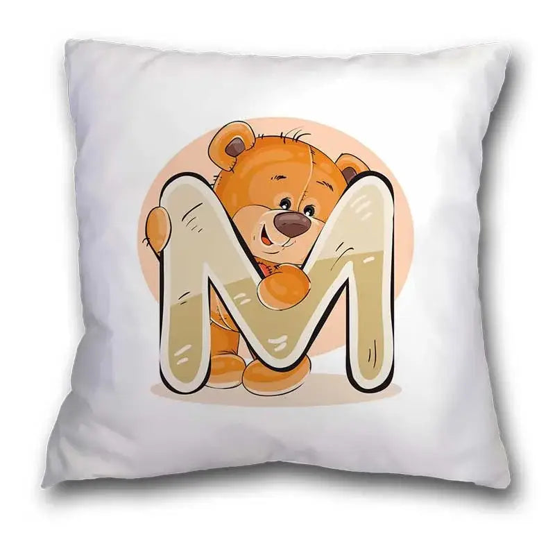 White pillow case featuring a cute cartoon bear animal holding a beige letter m for bedroom decor