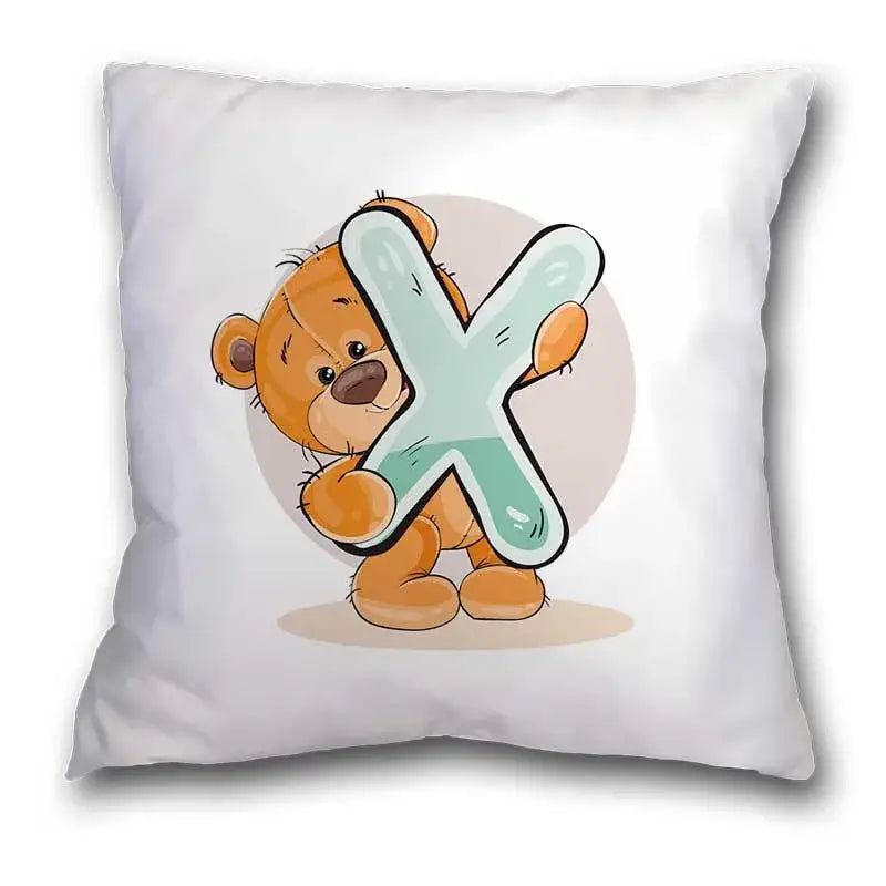 White pillow case featuring a cute cartoon bear animal holding a light teal letter x for bedroom decor