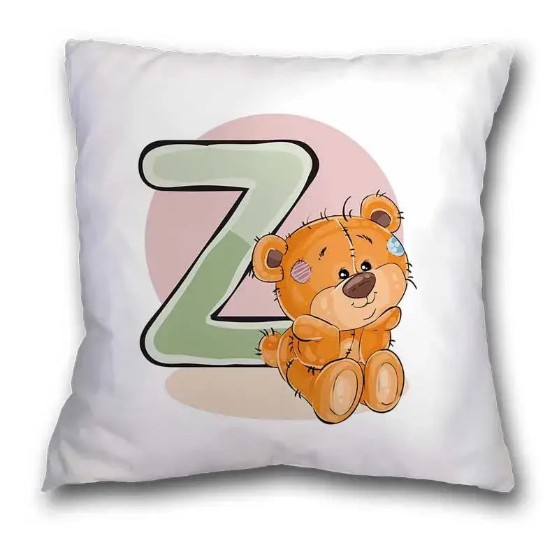 White throw pillow case with cute cartoon bear animal and green letter z on pink background for bedroom decor