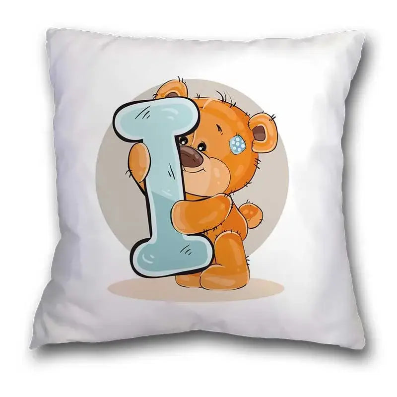 White pillow case with cute cartoon bear holding light blue letter i for bedroom decor featuring cartoon bear animal