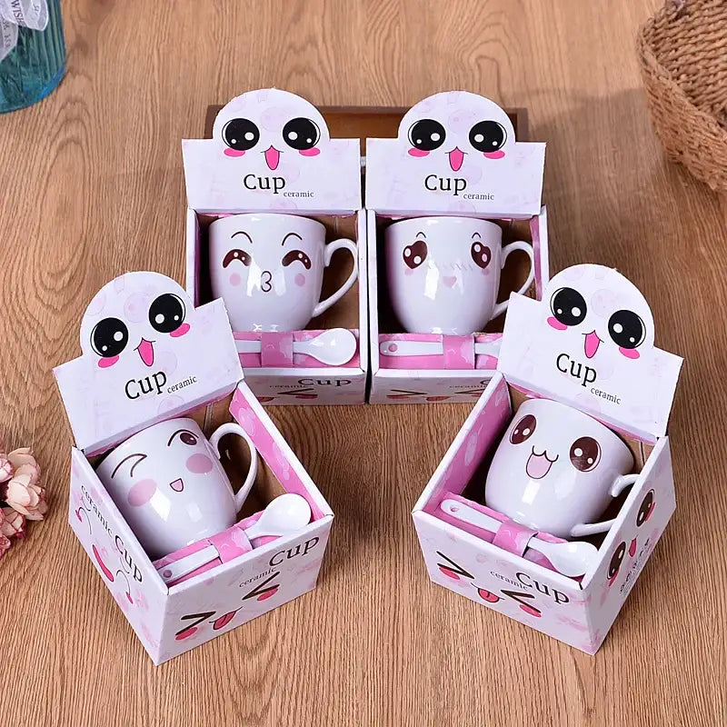 White ceramic cartoon coffee mug set with pink accents and matching spoons in decorative box for kitchen couple gift