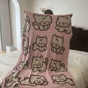 Pink knitted flannel blanket featuring a cute cartoon beige and brown cat pattern perfect as a bedroom throw