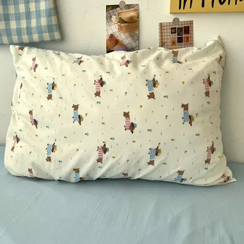 A cute cartoon washed cotton bedding set pillowcase in cream featuring playful bears in striped shirts and hats