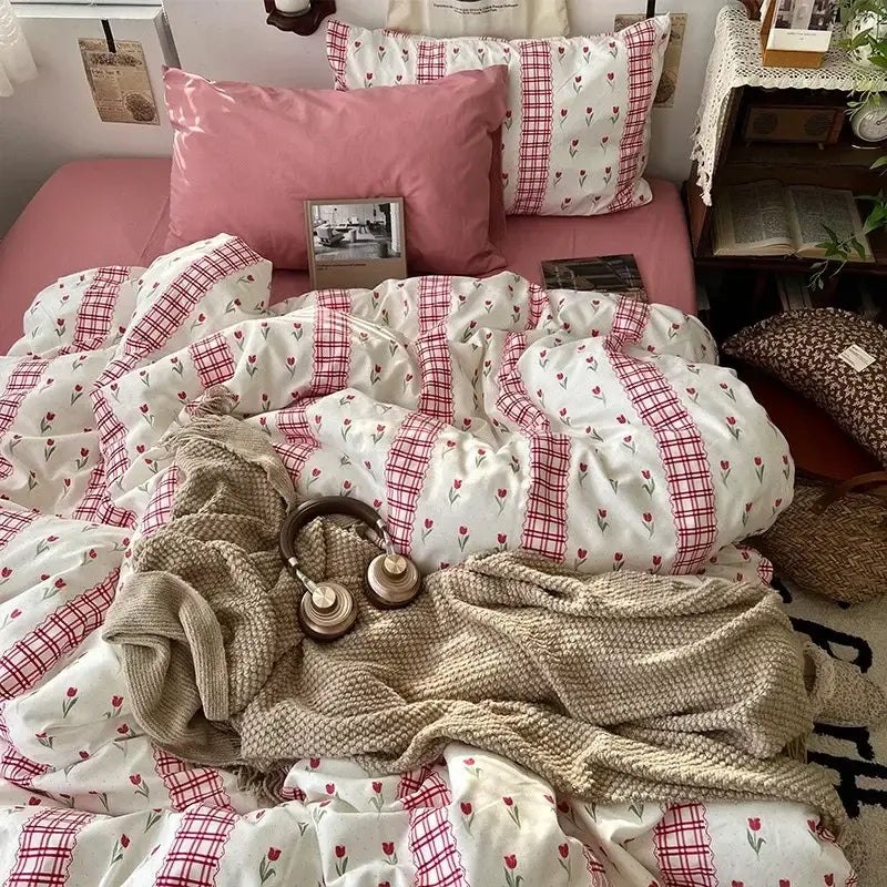 Cute cartoon washed cotton bedding set with pink and white floral pattern and red plaid accents for bedroom use