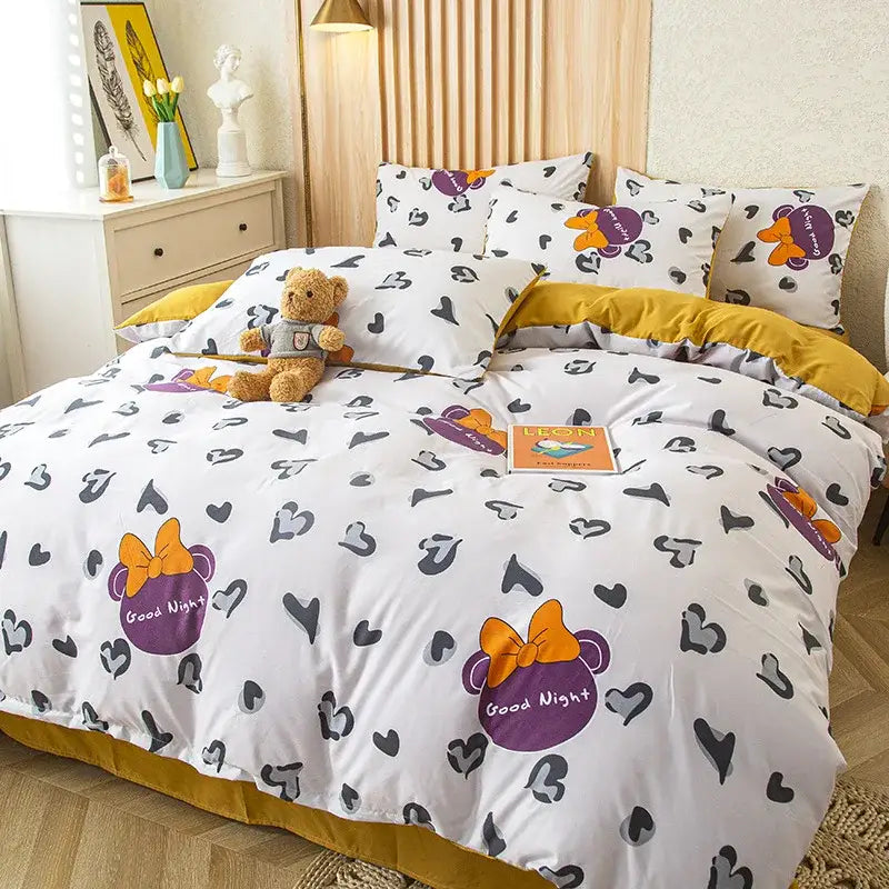 White duvet set with purple and orange minnie mouse prints good night text and mustard yellow border bedding set