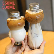 Cute cat beverage bottle made of plastic with silver caps filled with iced coffee and tapioca pearls for portable use
