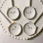 White ceramic cute cat ceramic spoons with colorful ear accents and adorable facial expressions for dessert serving