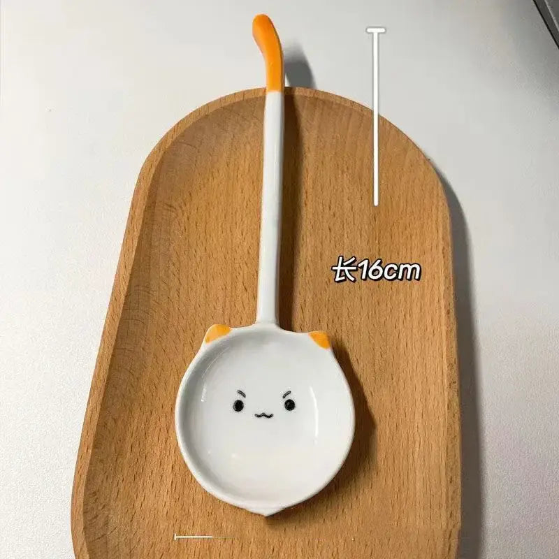 White ceramic cat ceramic spoon with orange-tipped handle and cute face for kitchen and dining room dessert serving