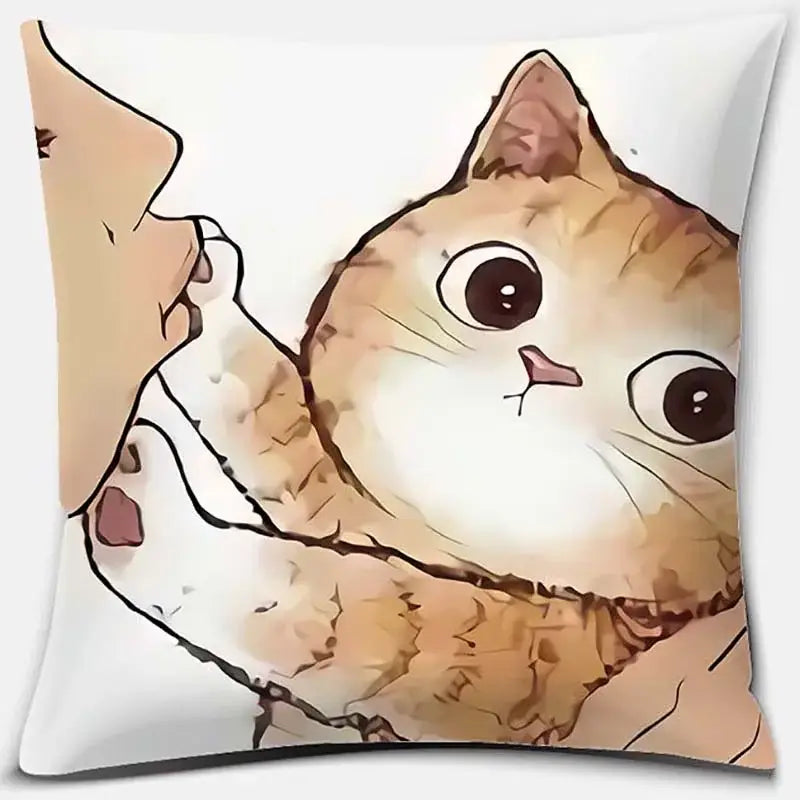 White throw pillow featuring cute cat kiss design of orange tabby cat with wide eyes held by a human hand
