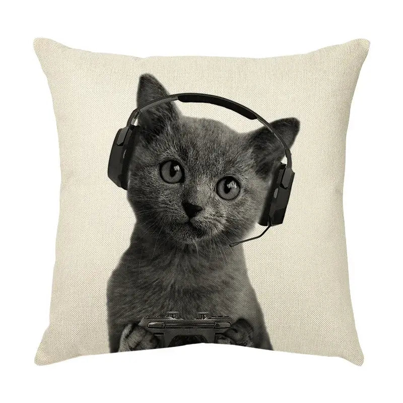 Beige linen throw pillow with a black-and-white print of a gray kitten wearing headphones and holding a game controller for cute cat sofa cotton linen use