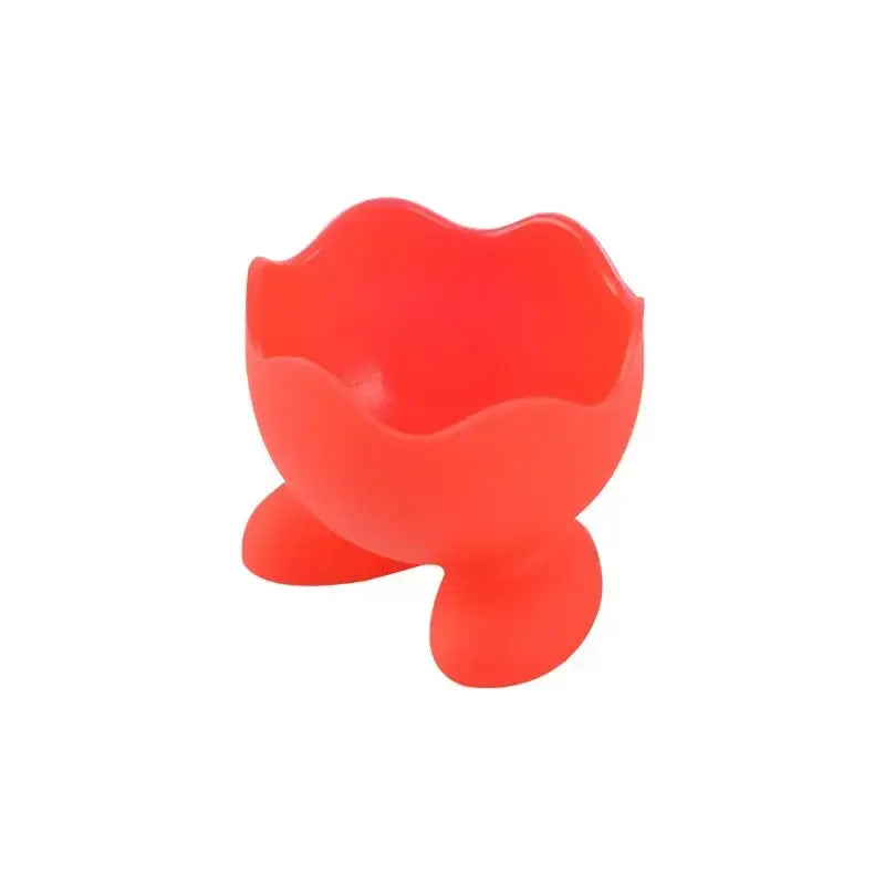 Bright red silicone egg cup holder with flower-like rim and three rounded feet for kitchen breakfast use